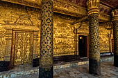 Luang Prabang, Laos - Wat Mai, the gilded stucco engravings of the veranda. 